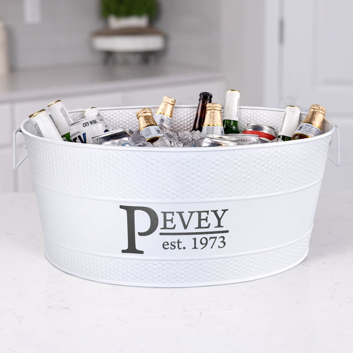 Personalized white beverage tub with large size to chill beer, wine, and other drinks with ice for parties in the home kitchen or on the patio. Easy to clean glossy finish with long lasting hammered exterior. Sealed to be leak resistant and rust proof.