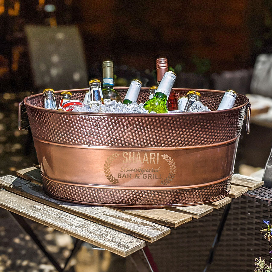 Beverage tub in copper finish color with easy to clean high glossy finish and sealed bottom to prevent leaking. Large 6 gallon size holds all of the wine, beer, and other drinks with ice for chilling at your next party. Celebrate a wedding, anniversary, or birthday. Add a custom name, monogram, or initial for a personalized gift or gift basket.