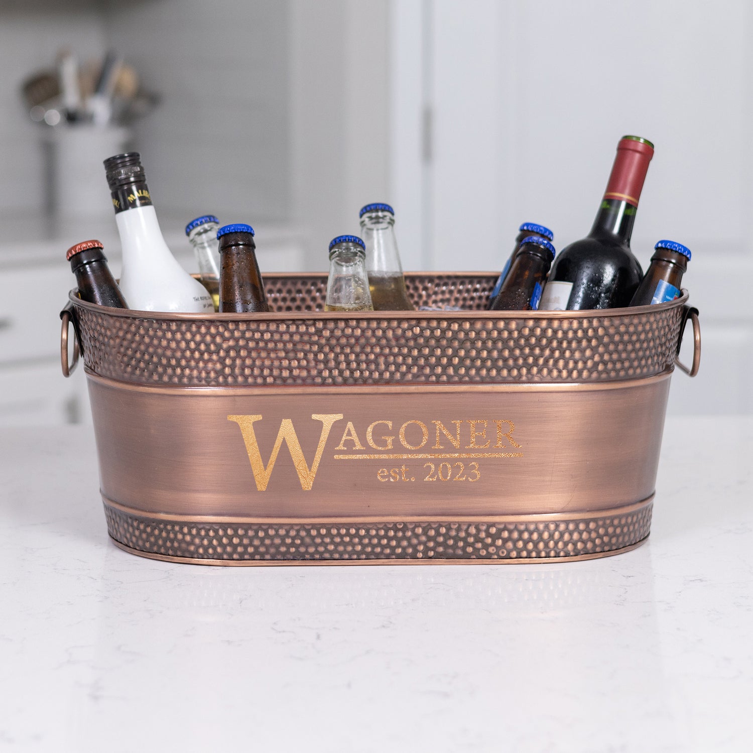 Personalized copper drink bucket to chill wine and beer for parties.  Great wedding, anniversary, or housewarming gift with the added custom name, monogram, or message.