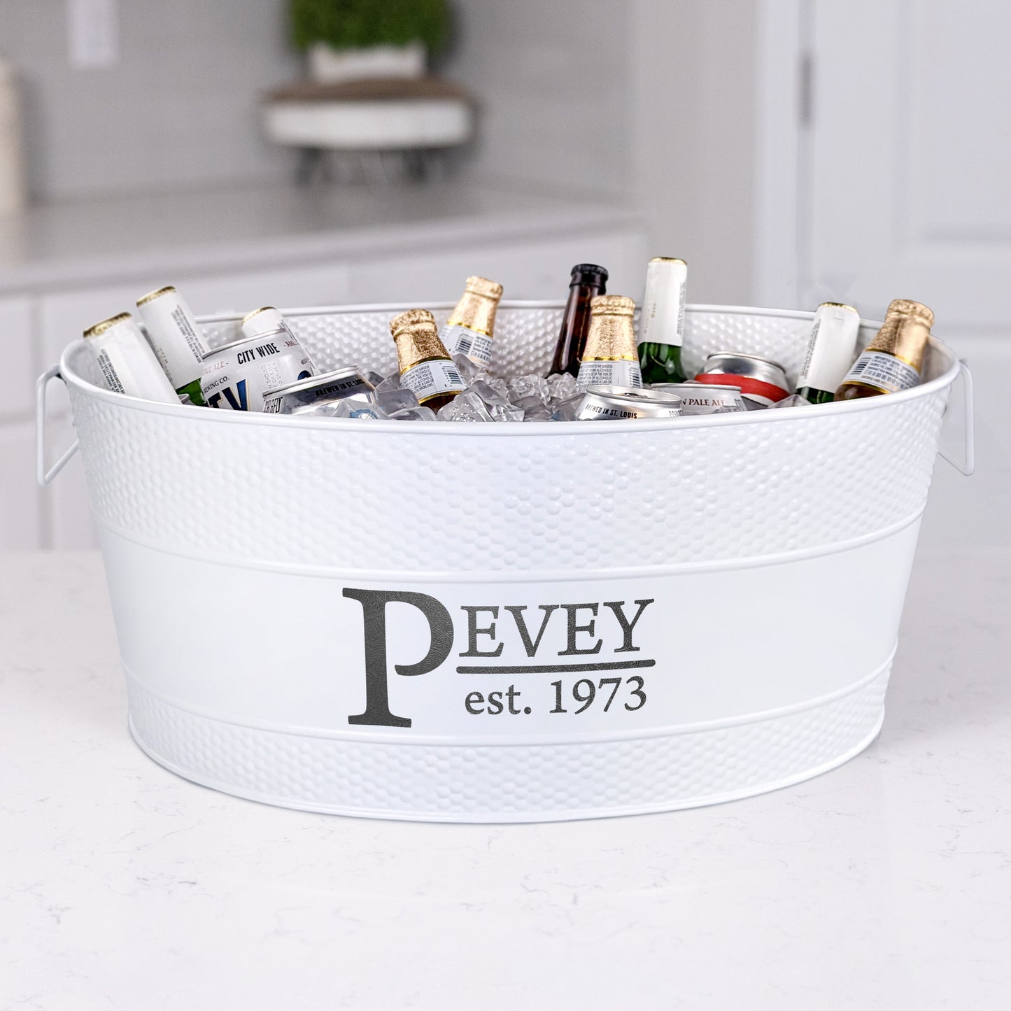 Personalized white beverage tub with large size to chill beer, wine, and other drinks with ice for parties in the home kitchen or on the patio.  Easy to clean glossy finish with long lasting hammered exterior.  Sealed to be leak resistant and rust proof.