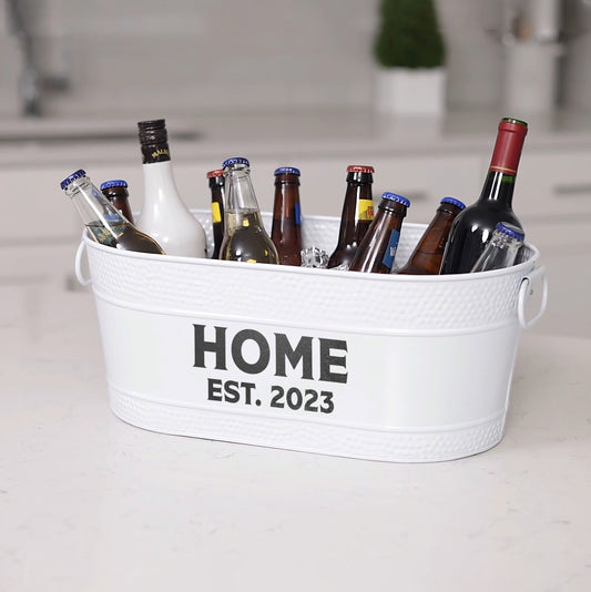 White custom drink cooler with custom name or monogram included on front.  Chill drinks with ice in the kitchen or on the patio.  Makes for a great gift for a housewarming or anniversary.  Large oval shape and easy to clean glossy finish.