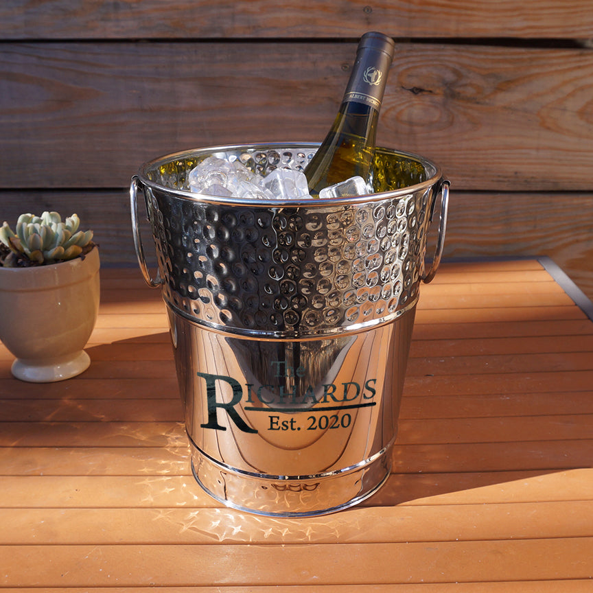 Wine or champagne drink bucket chiller made of stainless steel metal.  Use for parties in the kitchen, bar, dining room, or on the patio.  Personalize with a custom name, initial, or monogram.  Great for wedding, anniversary, birthday, or holiday party use.