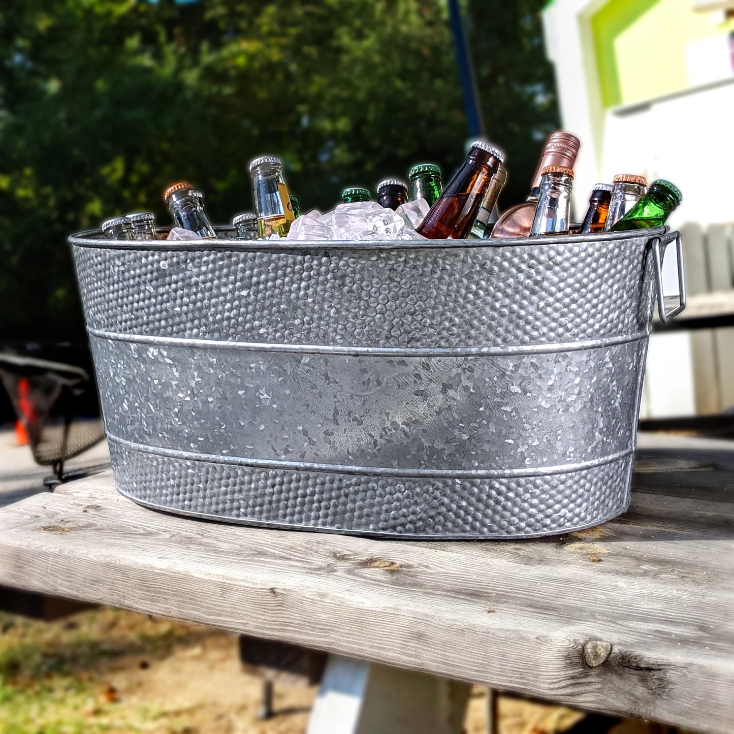 Large galvanized beverage tub to hold and chill wine, beer, drinks with ice.  Use at your parties in the kitchen or on the patio.  Great for serving drinks at holiday parties celebrating a wedding, anniversary, or birthday.  Sealed bottom to prevent any leaking and two strong handles for easy carrying and dumping.
