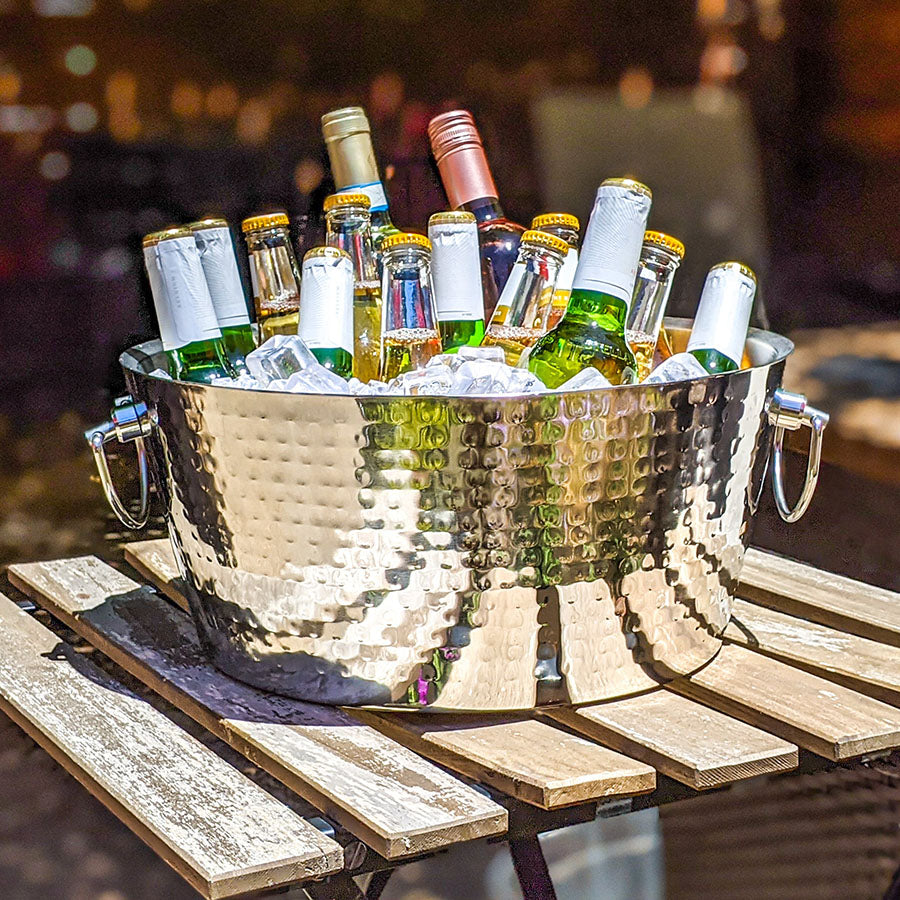 Large metal beverage tub round for parties.  Chill drinks, wine, beer, or champagne and serve to party guests in the home, in the restaurant, or during special events.  Celebrate weddings, anniversaries, and holidays serving ice cold drinks.