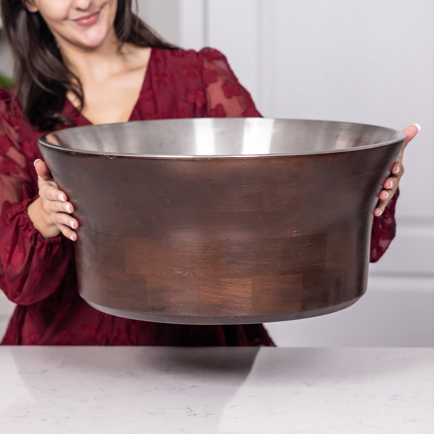 Large round beverage tub, insulated and double walled, with an interior stainless steel and exterior mango wood.  100% leak proof construction.  Absolutely no leaking.  Use in your home when celebrating a wedding, anniversary, birthday, or holiday.  Holds the most wine, beer, champagne, and other favorite drinks.