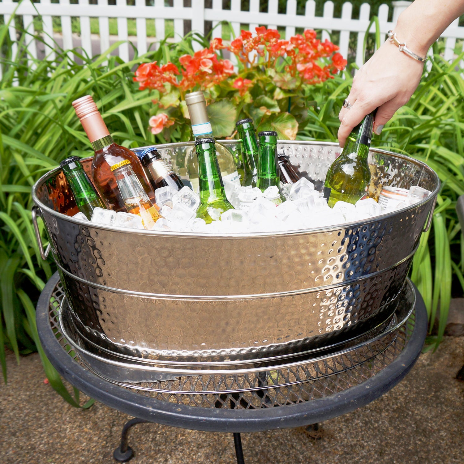 Beverage tub with party tray set for parties.  Chill and serve wine, beer, champagne or other drinks at parties indoors or out on the patio.  Large size holds all of the drinks for your party guests.  Includes a durable hammered exterior and sealed bottom to prevent leaking and rust.  Tray catches pesky party spills, splashes, and party tub condensation for a mess free party experience.