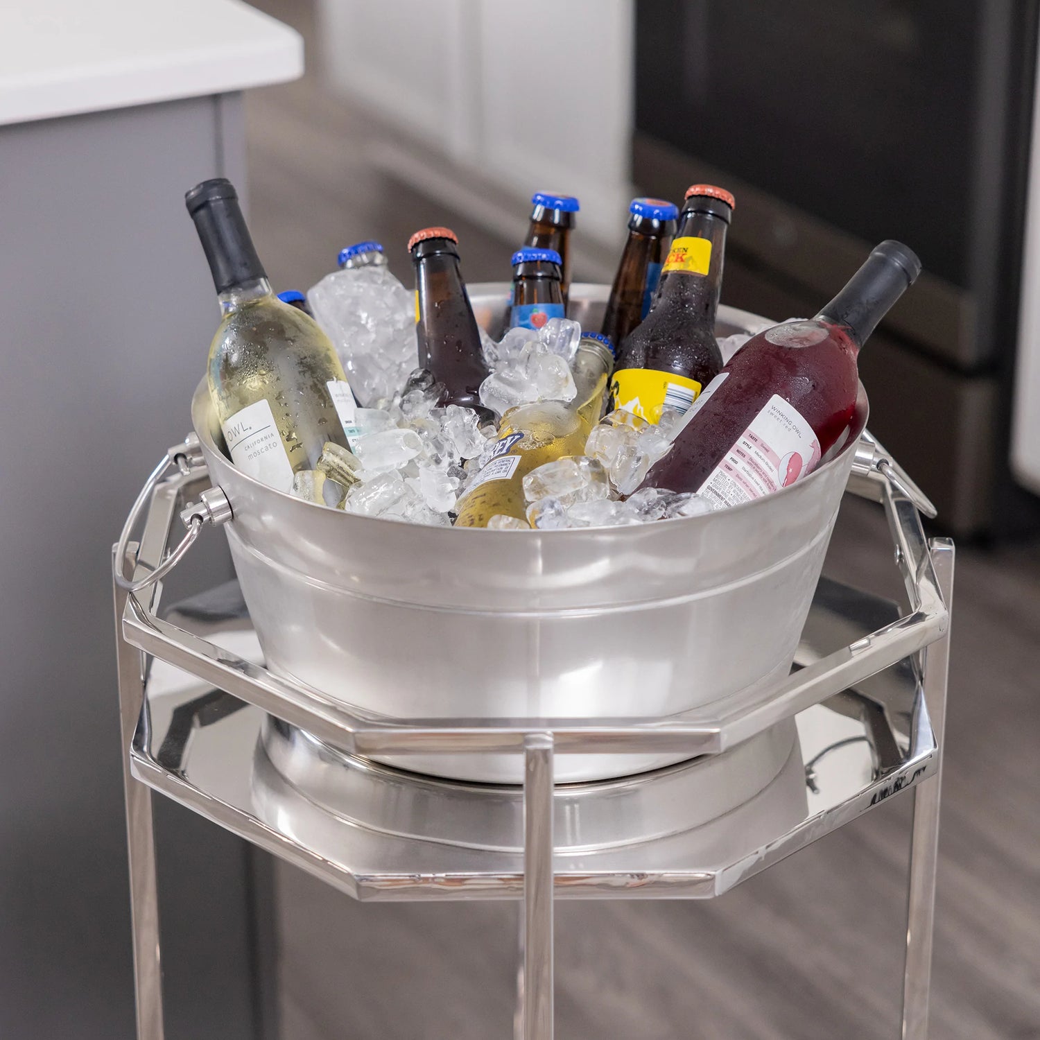 Insulated metal rolling cooler bar cart to chill drinks and wine for parties.  Includes shelves to hold wine bottles and barware or bar tools.  Personalize the party tub with a custom name, initial, or monogram.